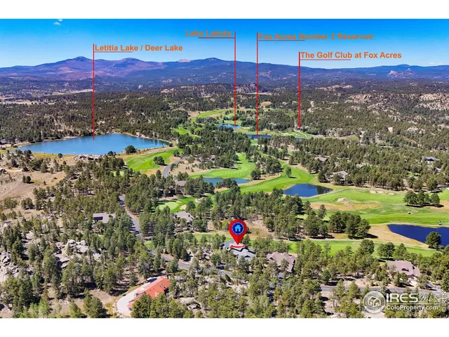 a view of a city with mountains in the background