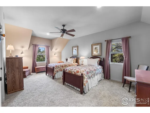 a bed room with a bed mirror and a balcony