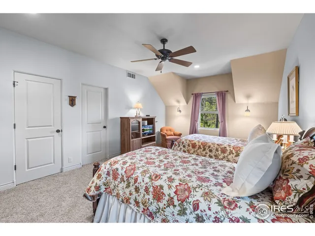 a view of a room with wooden floor and furniture