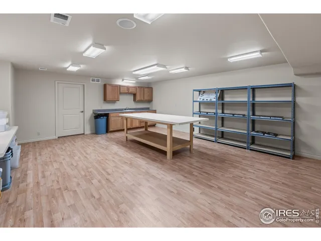 a open kitchen with cabinets table and chairs