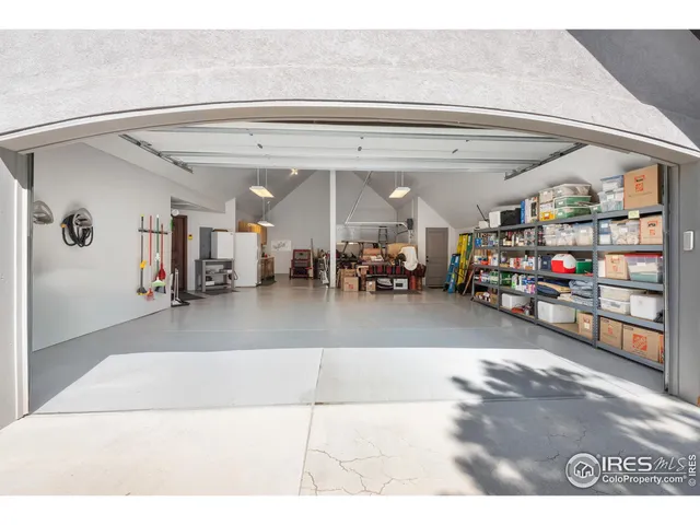 a kitchen with stainless steel appliances a refrigerator and a wooden floor