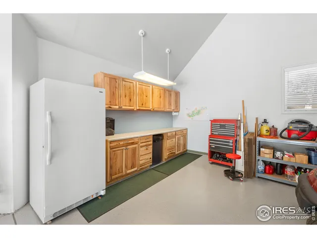a children room with furniture and a window