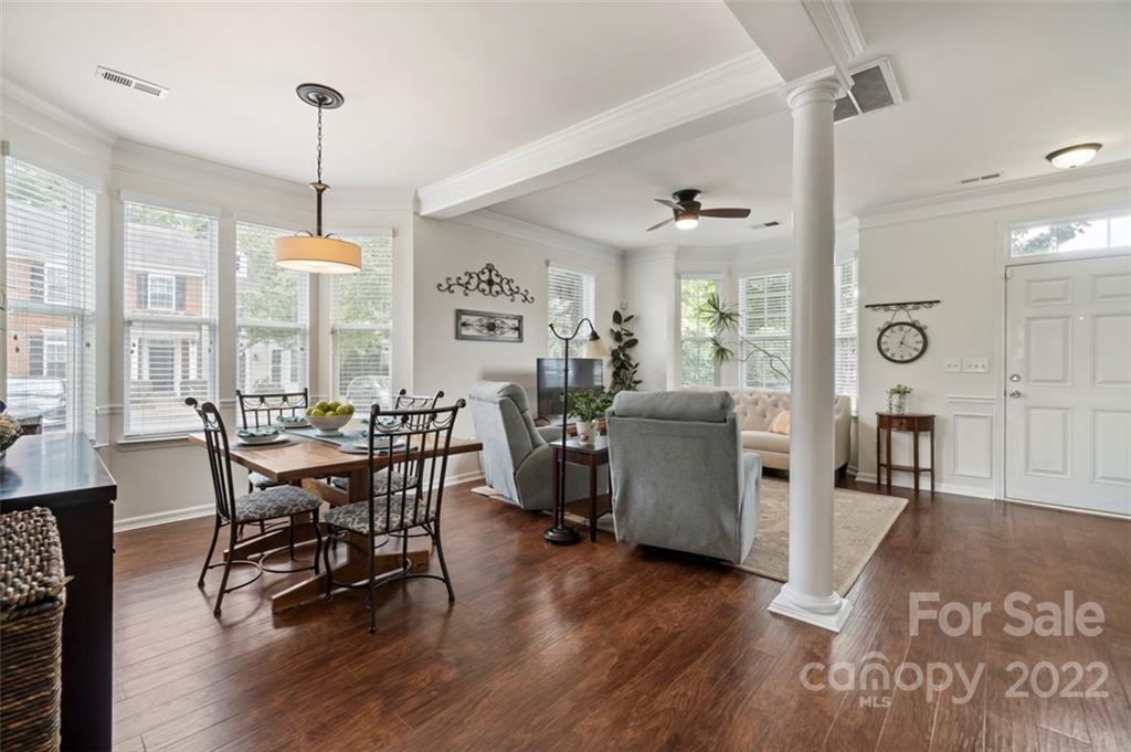 7383 Laurel Valley Road Charlotte, NC 28273 - Photo 11 of 37 a view of a dining room with furniture window and wooden floor