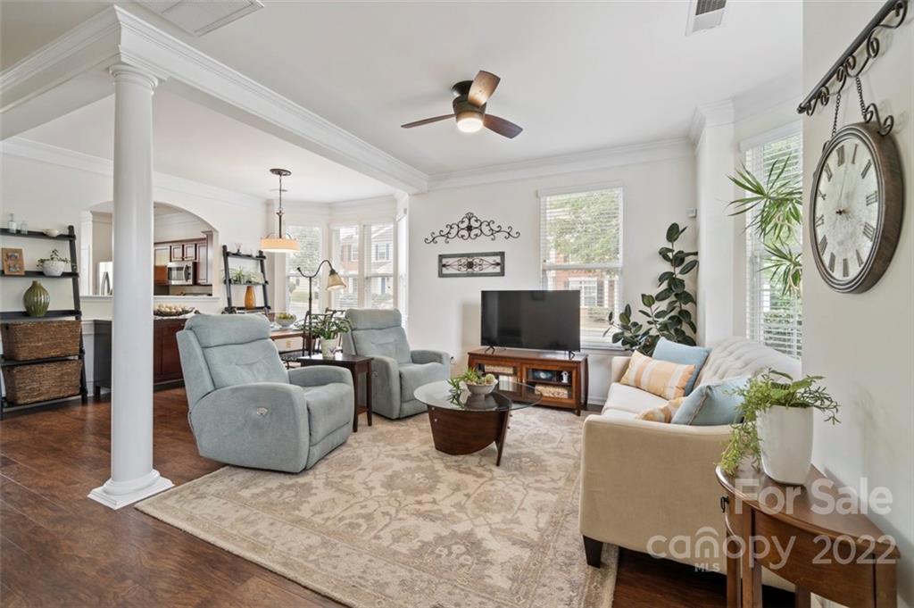 7383 Laurel Valley Road Charlotte, NC 28273 - Photo 14 of 37 a living room with furniture a flat screen tv and a fireplace
