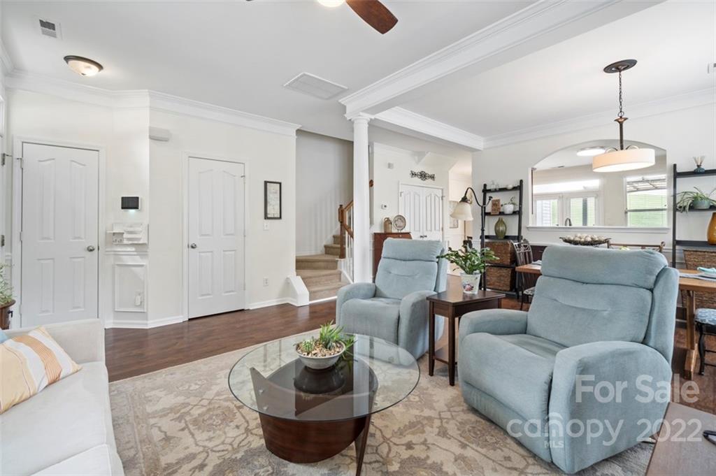 7383 Laurel Valley Road Charlotte, NC 28273 - Photo 16 of 37 a living room with furniture and a wooden floor