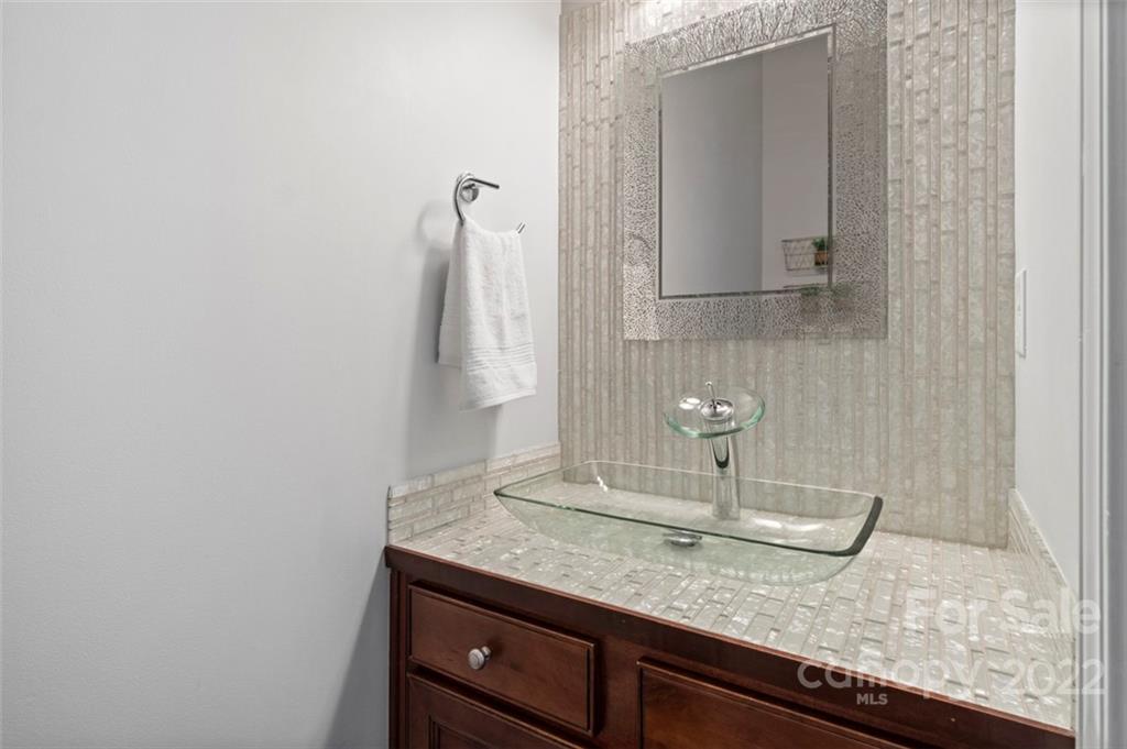 7383 Laurel Valley Road Charlotte, NC 28273 - Photo 17 of 37 a bathroom with a granite countertop sink and a mirror
