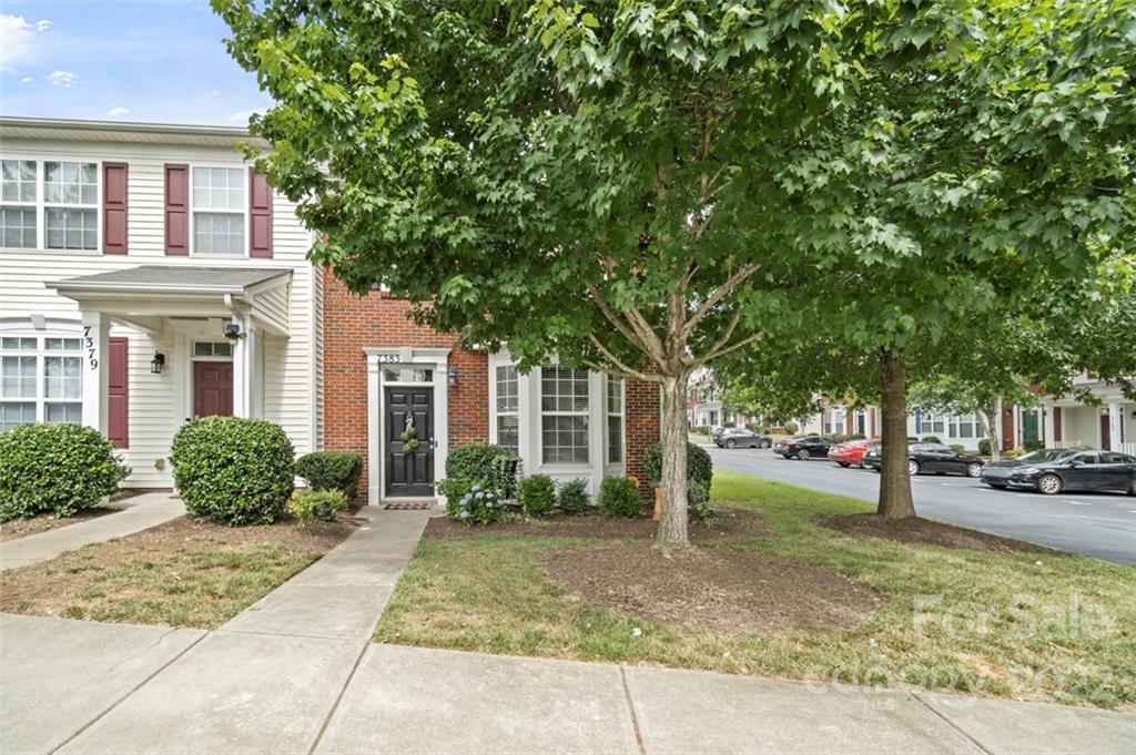 7383 Laurel Valley Road Charlotte, NC 28273 - Photo 2 of 37 a front view of a house with a yard