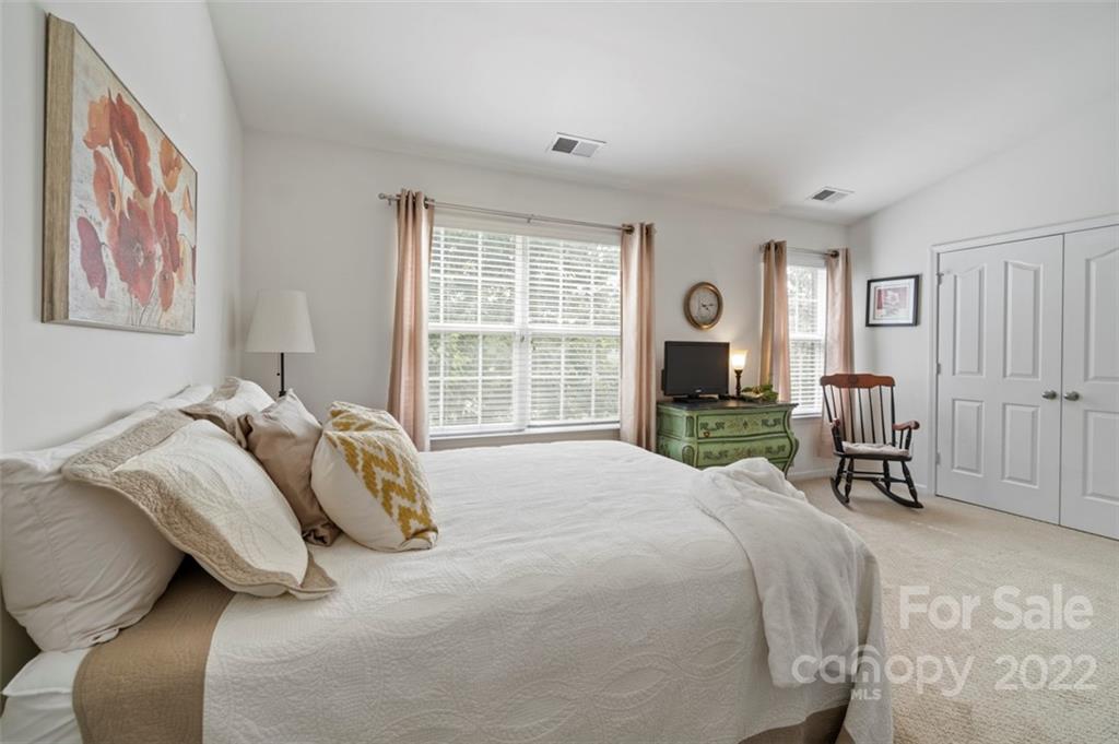 7383 Laurel Valley Road Charlotte, NC 28273 - Photo 29 of 37 a bedroom with a bed and a large window