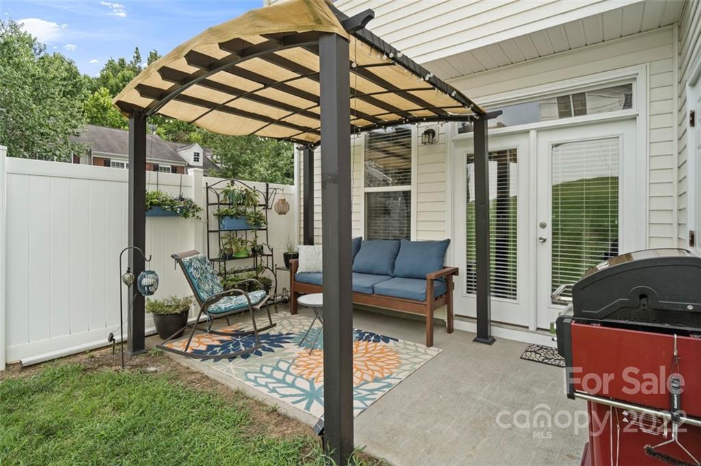 7383 Laurel Valley Road Charlotte, NC 28273 - Photo 33 of 37 a view of two chairs in the patio
