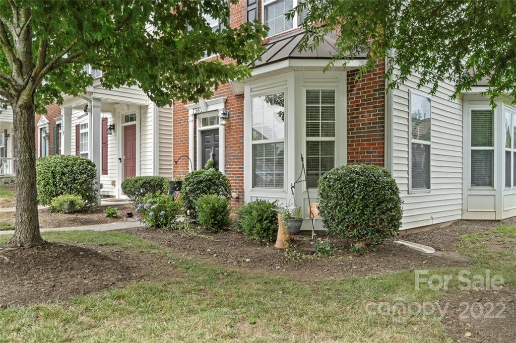 7383 Laurel Valley Road Charlotte, NC 28273 - Photo 37 of 37 a front view of a house with garden