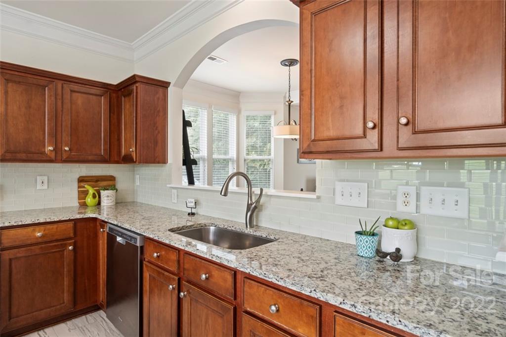 7383 Laurel Valley Road Charlotte, NC 28273 - Photo 5 of 37 a kitchen with sink cabinets and appliances