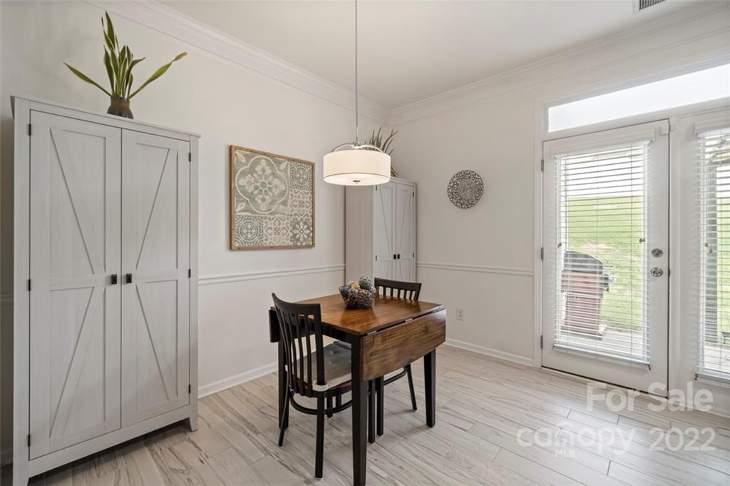 7383 Laurel Valley Road Charlotte, NC 28273 - Photo 9 of 37 a dining room with furniture and window