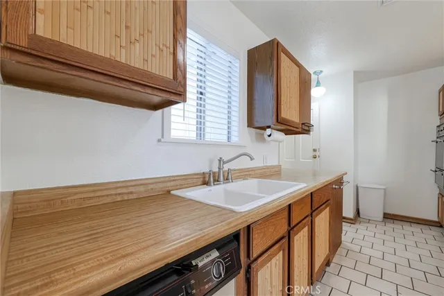 a bathroom with a sink a mirror and a shower