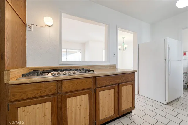 a kitchen with a sink cabinets and window