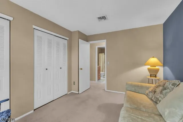 a bed room with a bed and a lamp