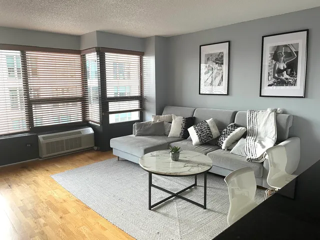 a living room with furniture and a window