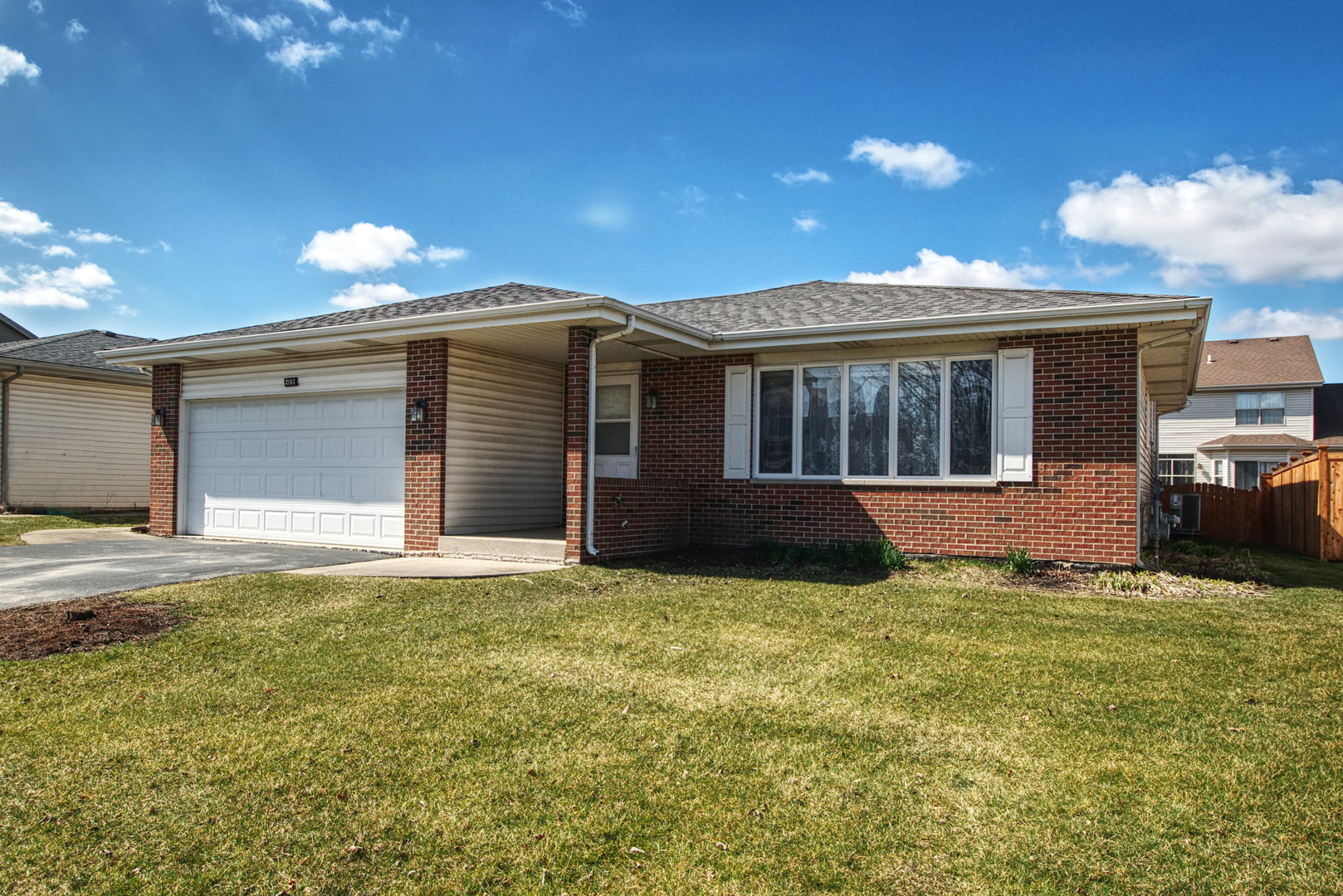 2103 Olde Mill Road Plainfield, IL 60586 - Photo 1 of 21 a view of a house with a yard and potted plants