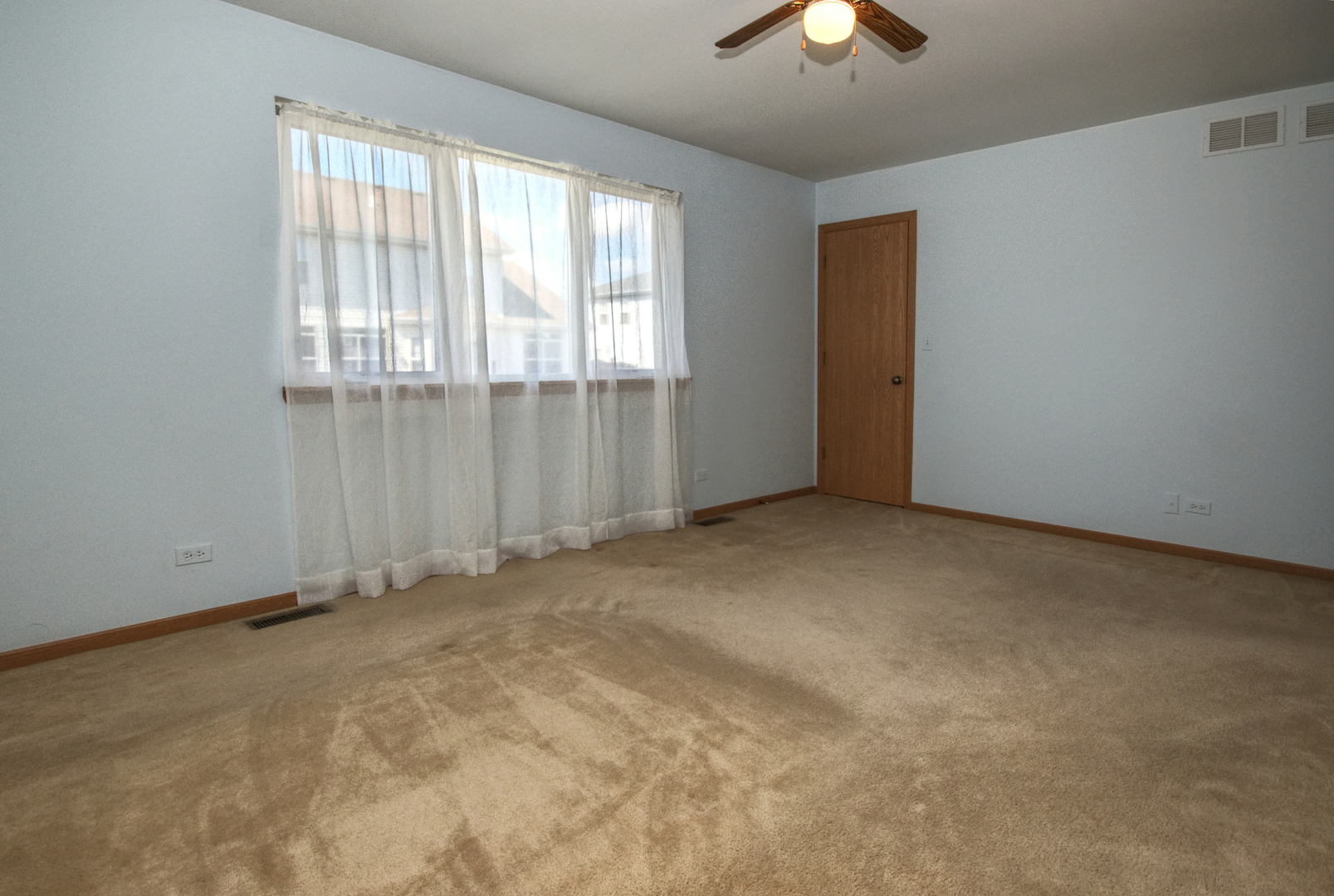 2103 Olde Mill Road Plainfield, IL 60586 - Photo 11 of 21 an empty room with chandelier fan