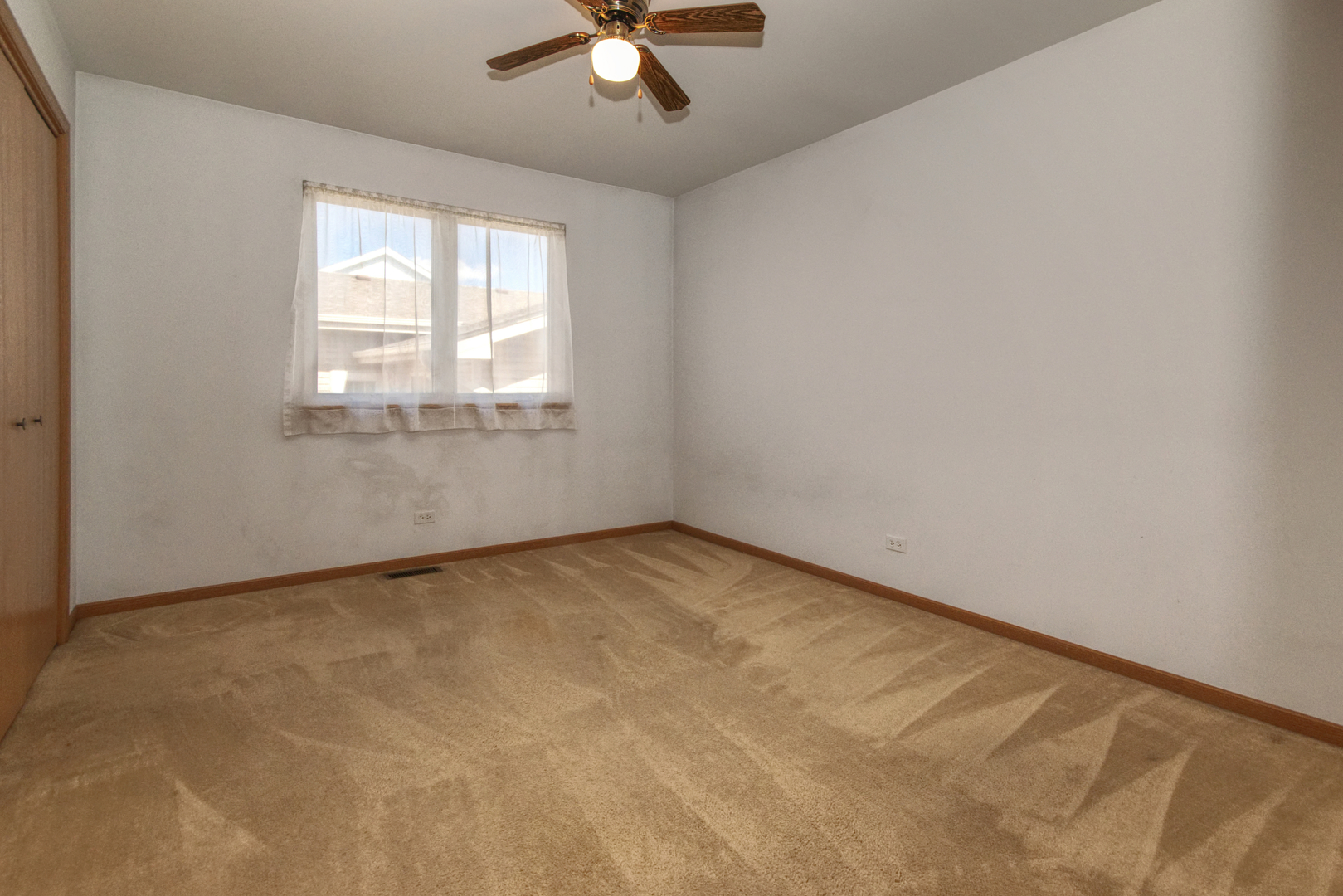 2103 Olde Mill Road Plainfield, IL 60586 - Photo 14 of 21 an empty room with a window