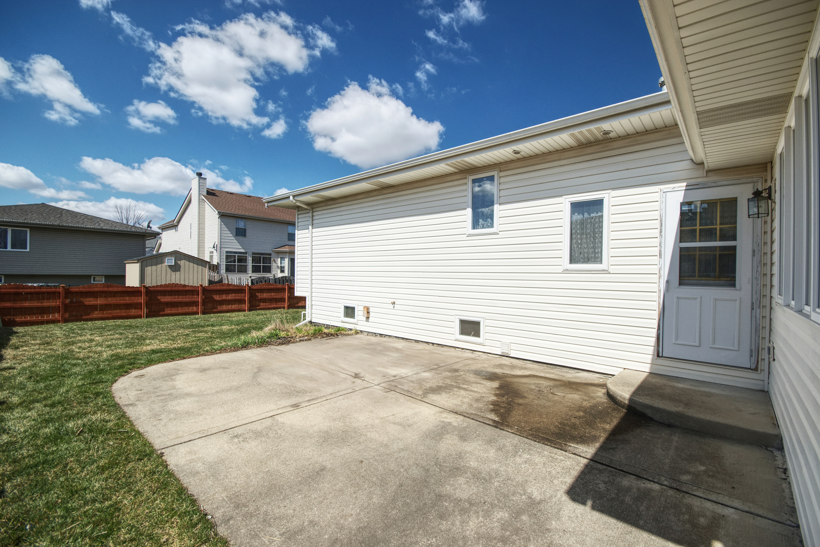 2103 Olde Mill Road Plainfield, IL 60586 - Photo 19 of 21 a view of a white house next to a yard