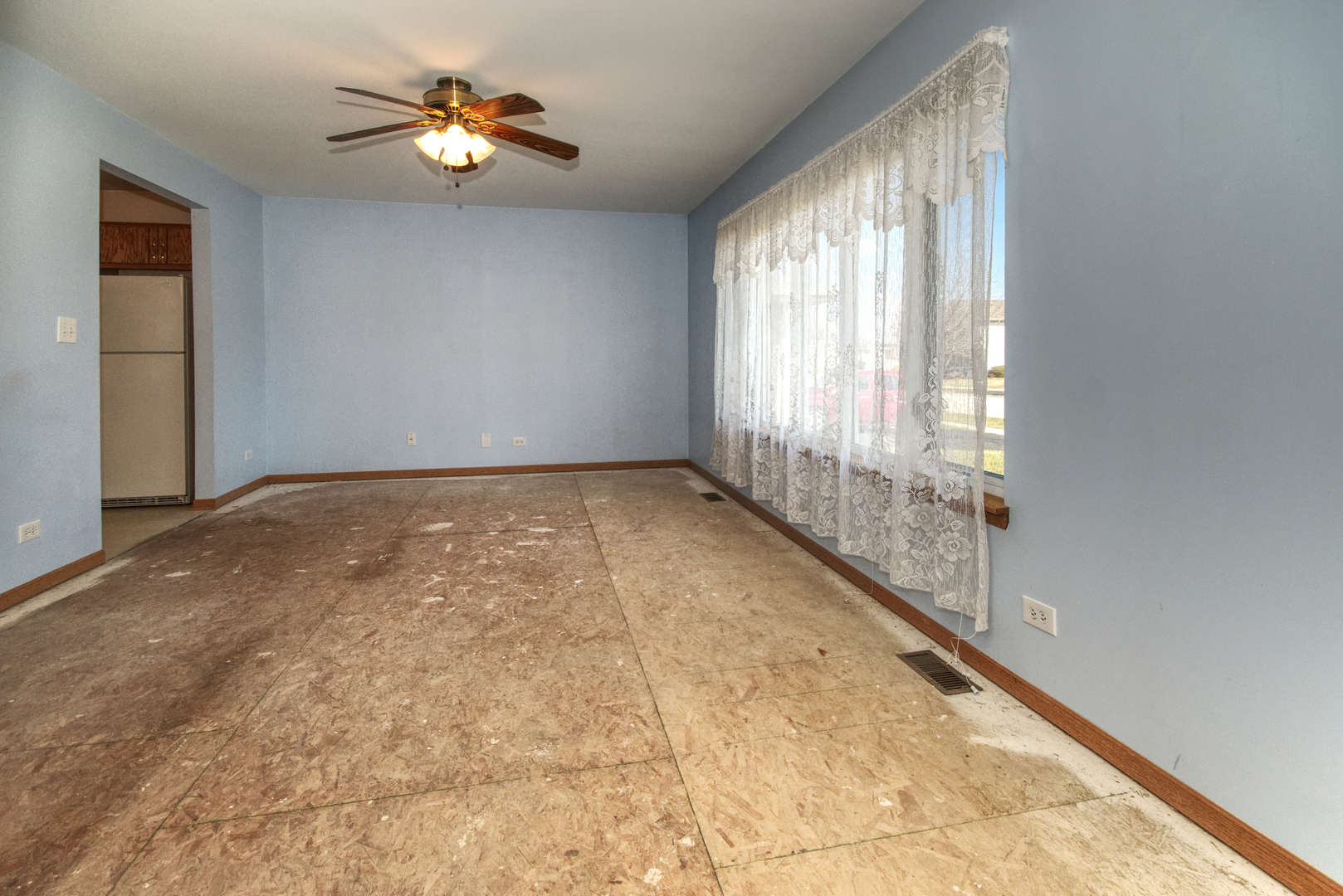 2103 Olde Mill Road Plainfield, IL 60586 - Photo 5 of 21 a view of an empty room with a window