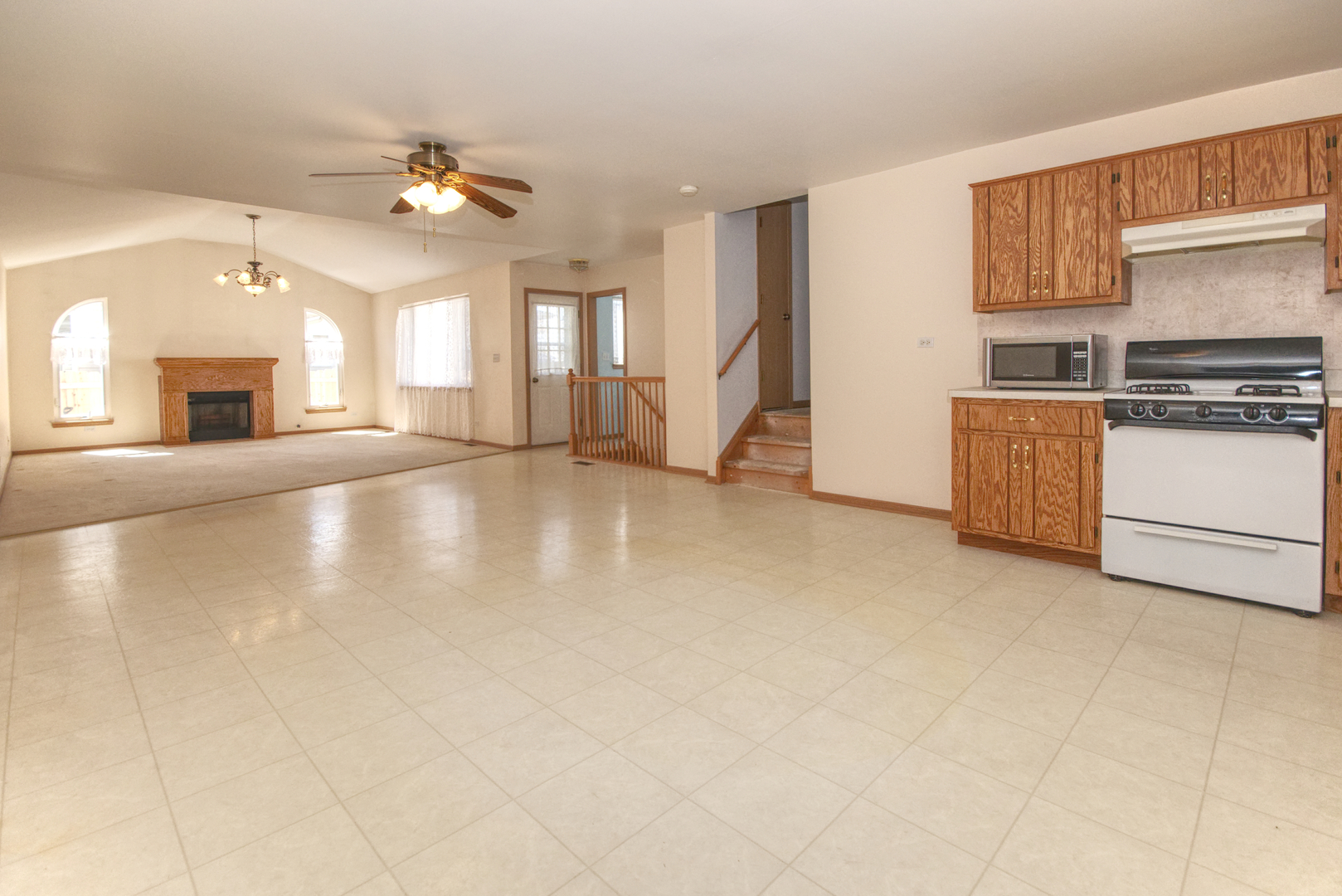 2103 Olde Mill Road Plainfield, IL 60586 - Photo 8 of 21 a view of a kitchen with a stove cabinets and a kitchen