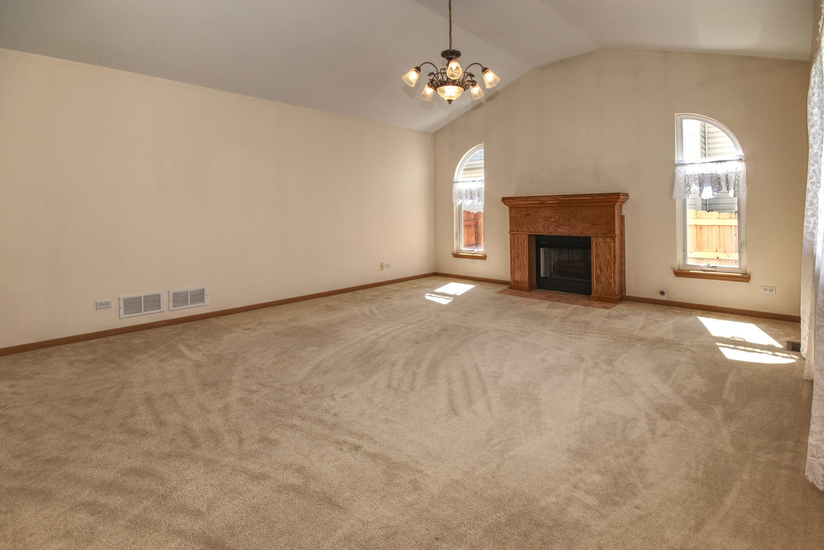 2103 Olde Mill Road Plainfield, IL 60586 - Photo 9 of 21 a view of an empty room with a fireplace