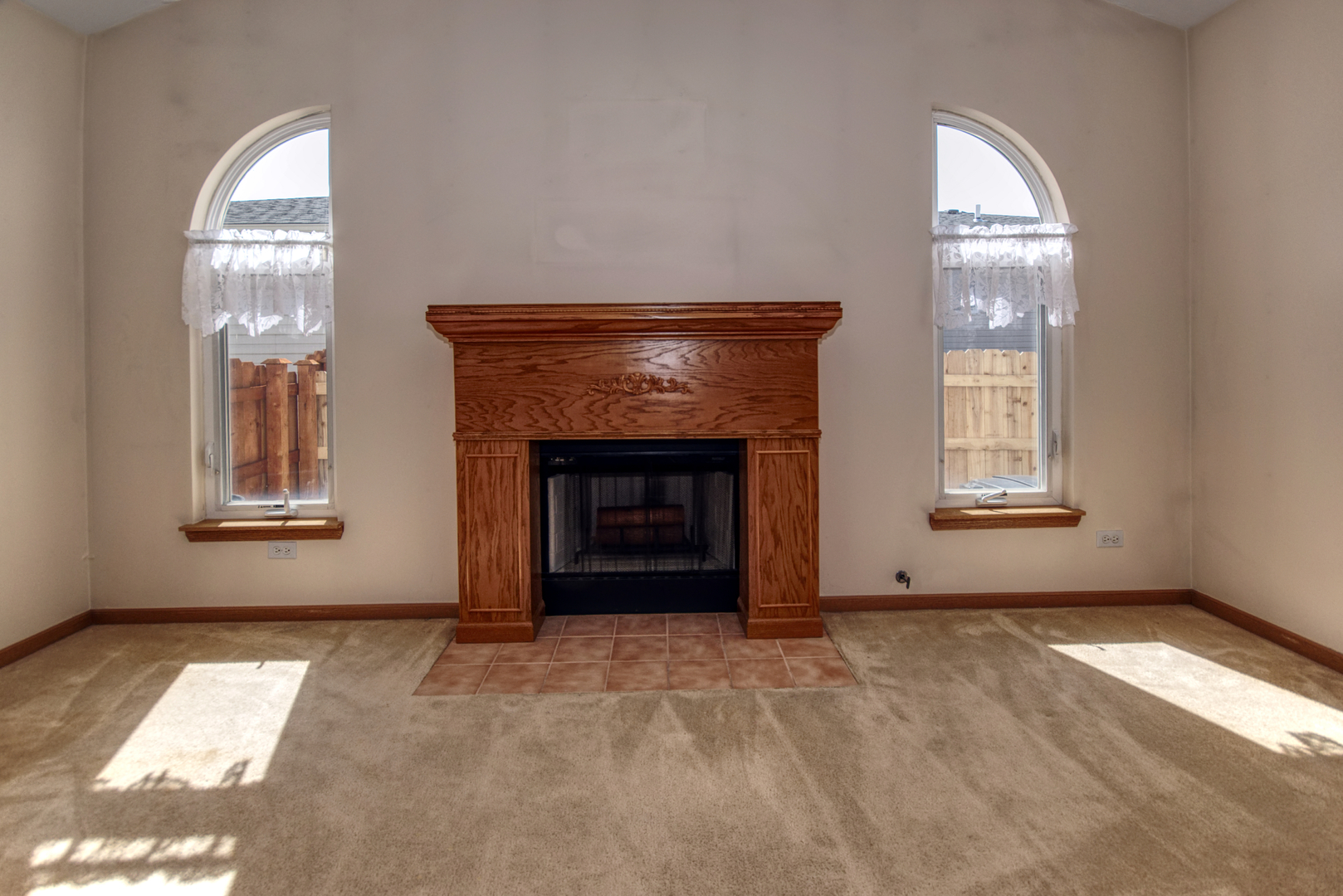 2103 Olde Mill Road Plainfield, IL 60586 - Photo 10 of 21 an empty room with windows and fireplace