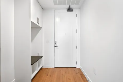 a view of bathroom with a sink and a mirror