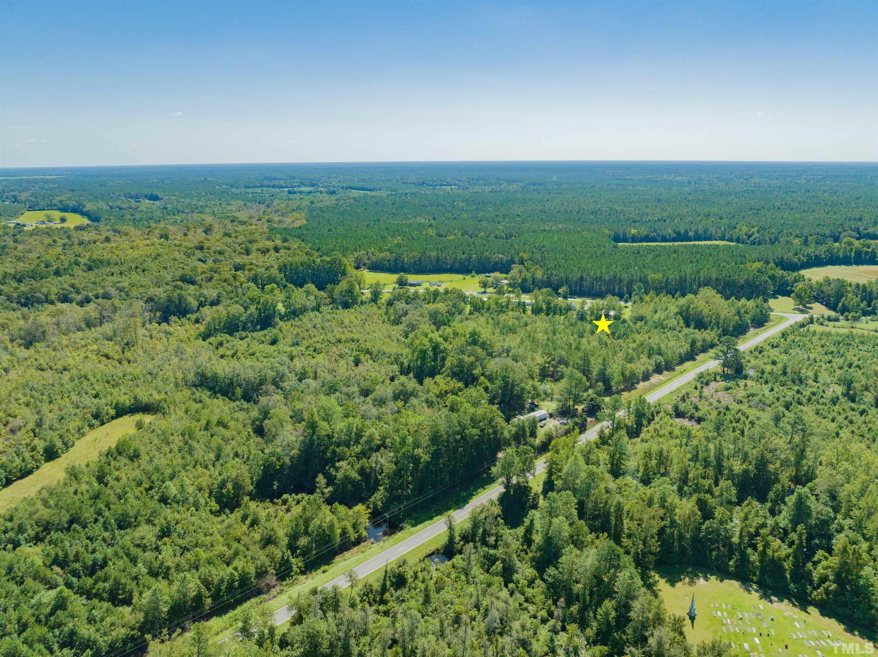 0 Halfway Branch Road Atkinson, NC 28421 - Photo 3 of 19 an aerial view of residential houses with outdoor space and trees