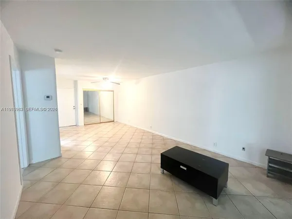 a room with a bed and a cabinets