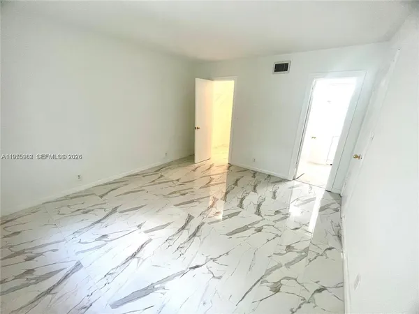 a view of a room with an empty space