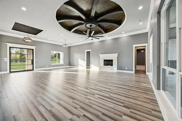 a view of a livingroom with a ceiling fan and window