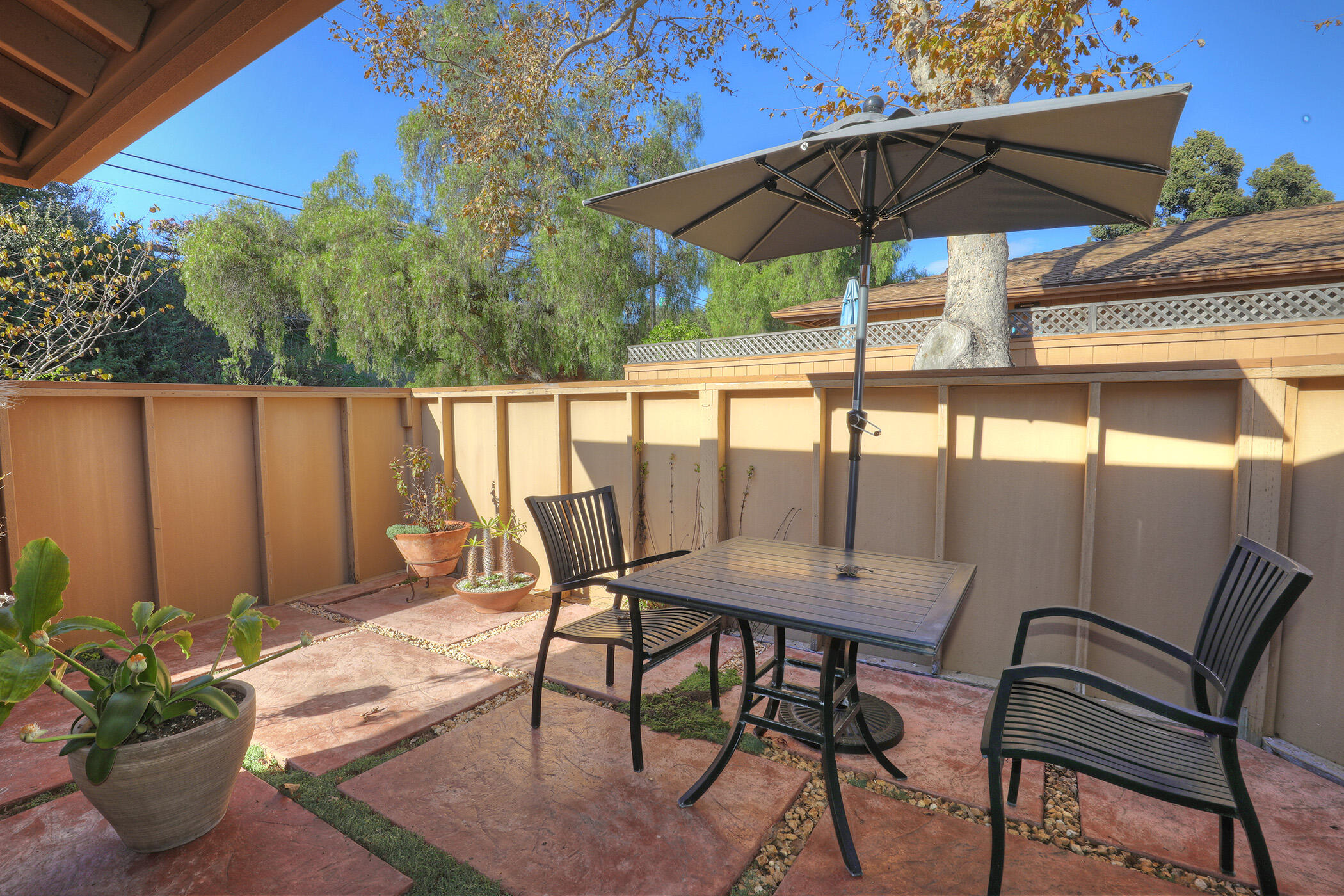 5290 Overpass Road, Unit 4 Goleta, CA 93111 - Photo 10 of 21 a view of a outdoor sitting area with furniture and umbrella