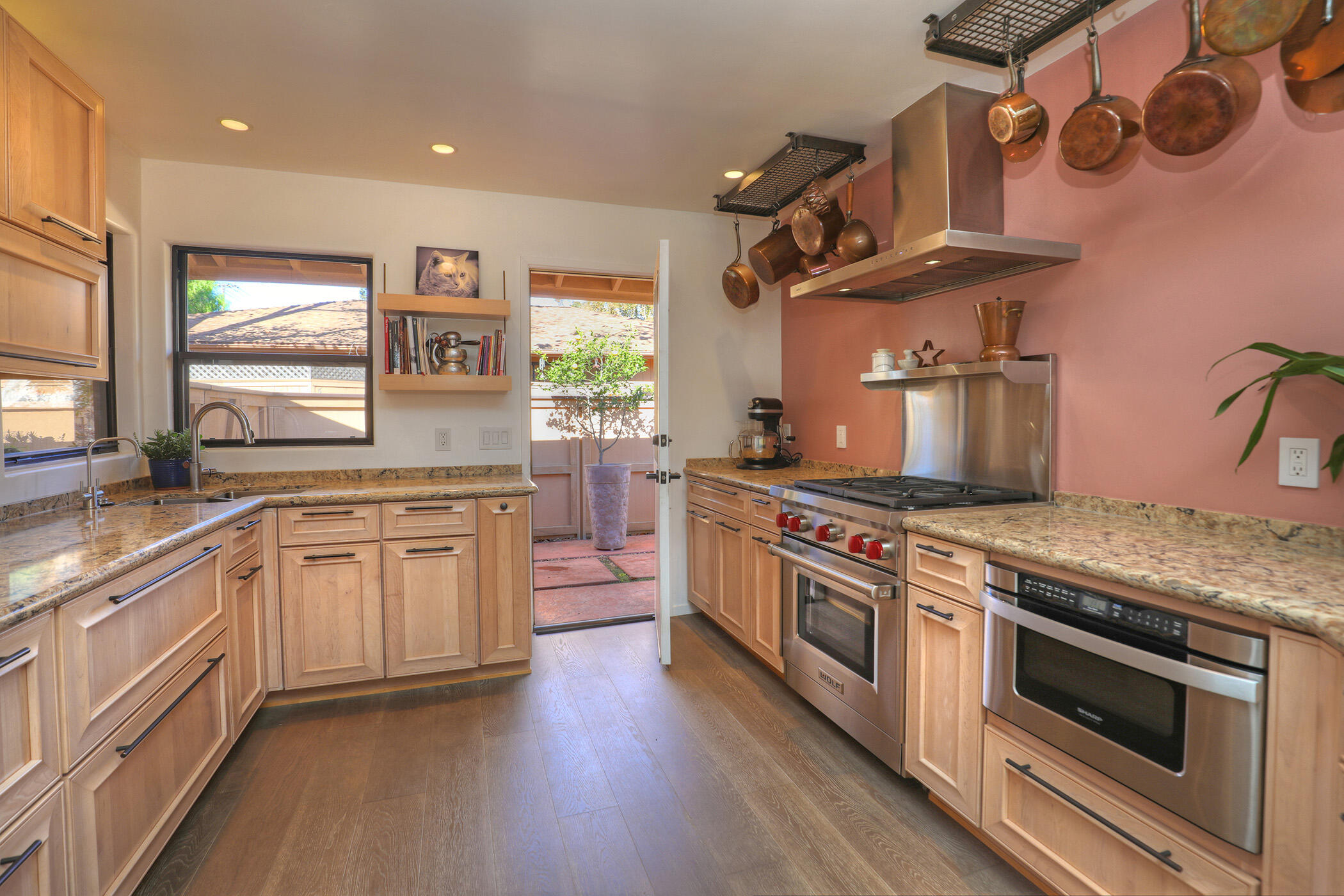 5290 Overpass Road, Unit 4 Goleta, CA 93111 - Photo 3 of 21 a kitchen with stainless steel appliances granite countertop a stove and a sink