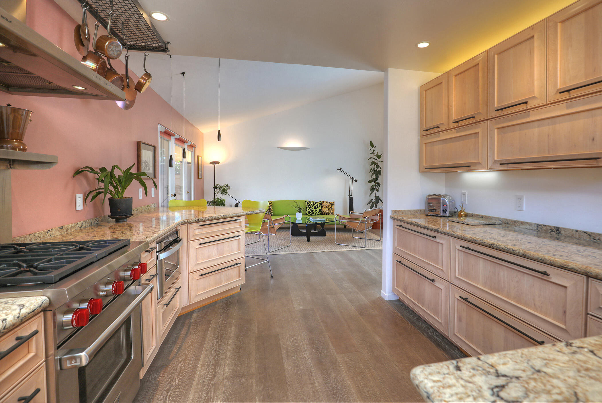 5290 Overpass Road, Unit 4 Goleta, CA 93111 - Photo 4 of 21 a kitchen with stainless steel appliances granite countertop a stove a sink dishwasher and cabinets with wooden floor