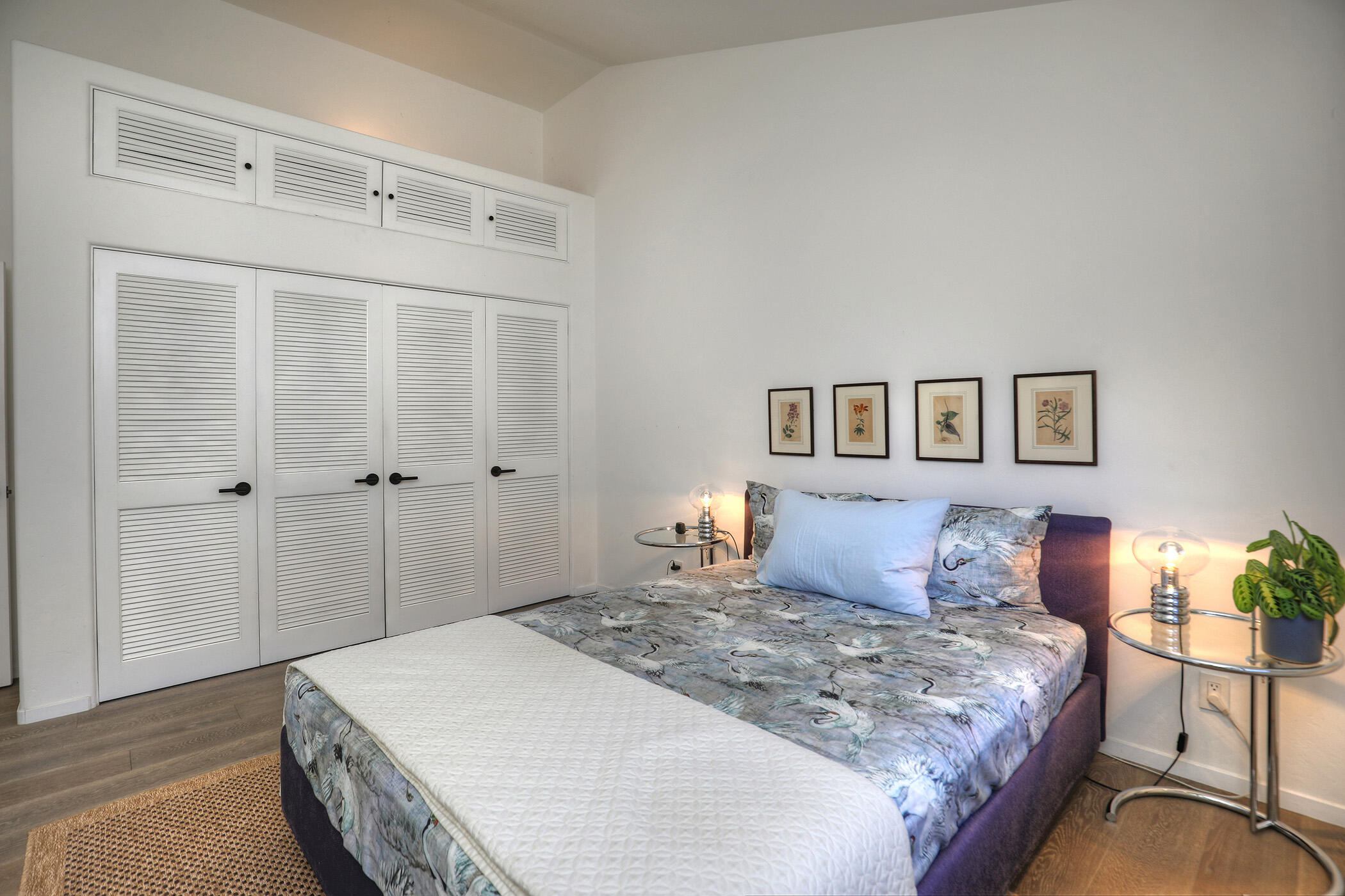 5290 Overpass Road, Unit 4 Goleta, CA 93111 - Photo 7 of 21 a bedroom with a large bed and a painting on the wall