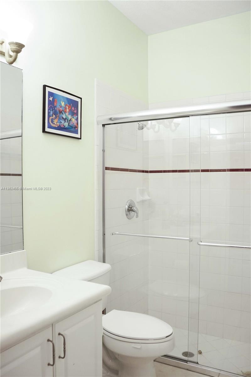 Miramar Miramar, FL 33029 - Photo 13 of 18 a bathroom with a toilet and a sink