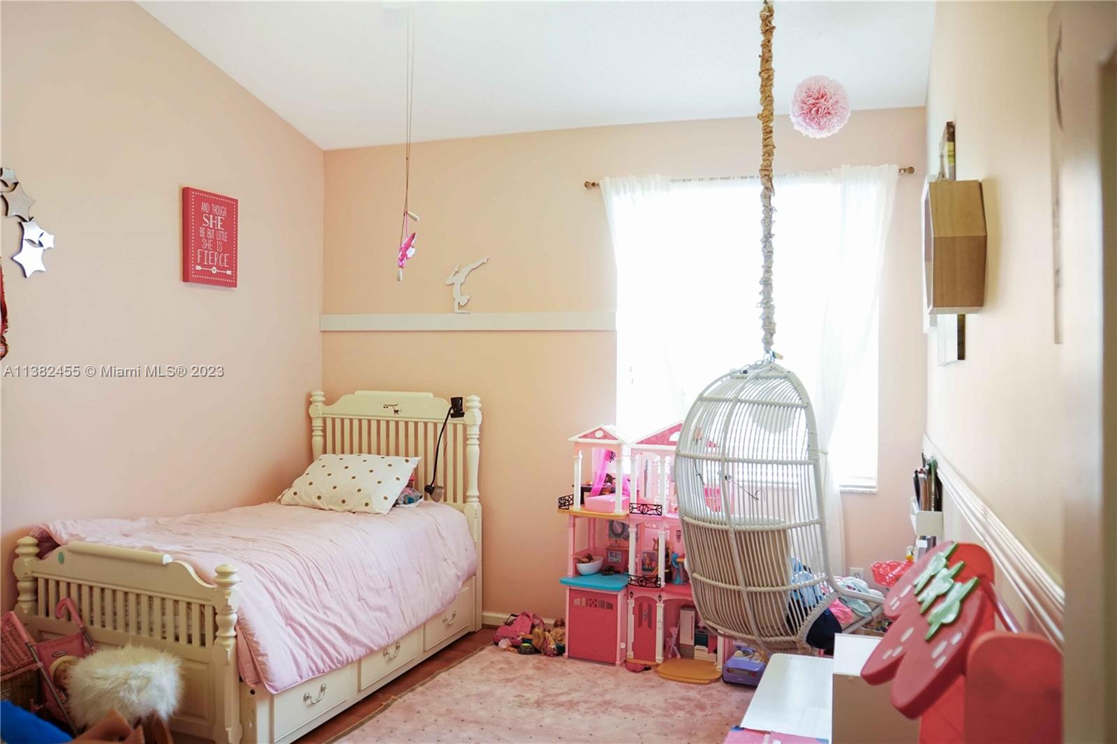 Miramar Miramar, FL 33029 - Photo 14 of 18 a bedroom with a bed and a chandelier