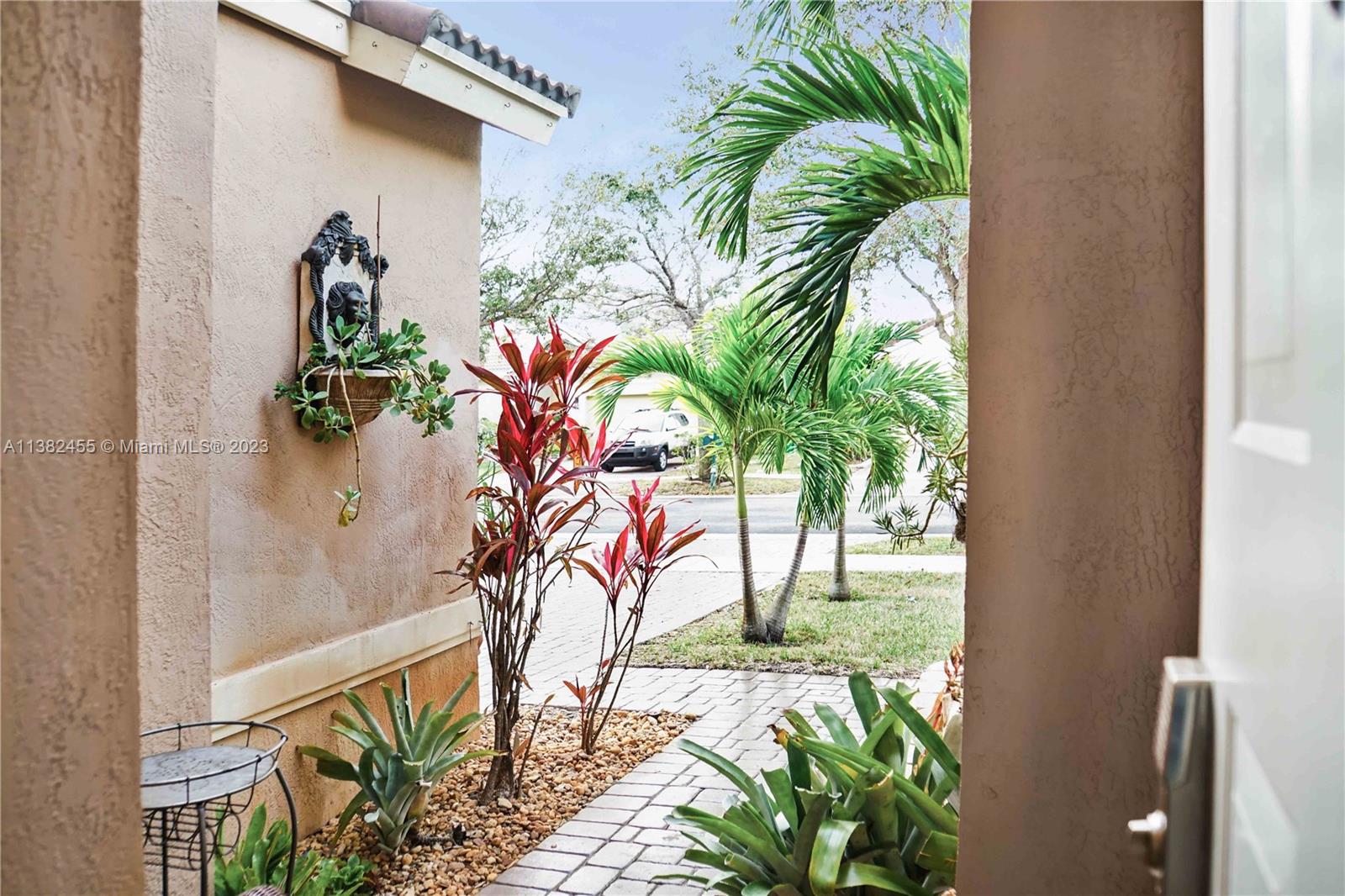 Miramar Miramar, FL 33029 - Photo 18 of 18 a picture of a glass door with a flower plants