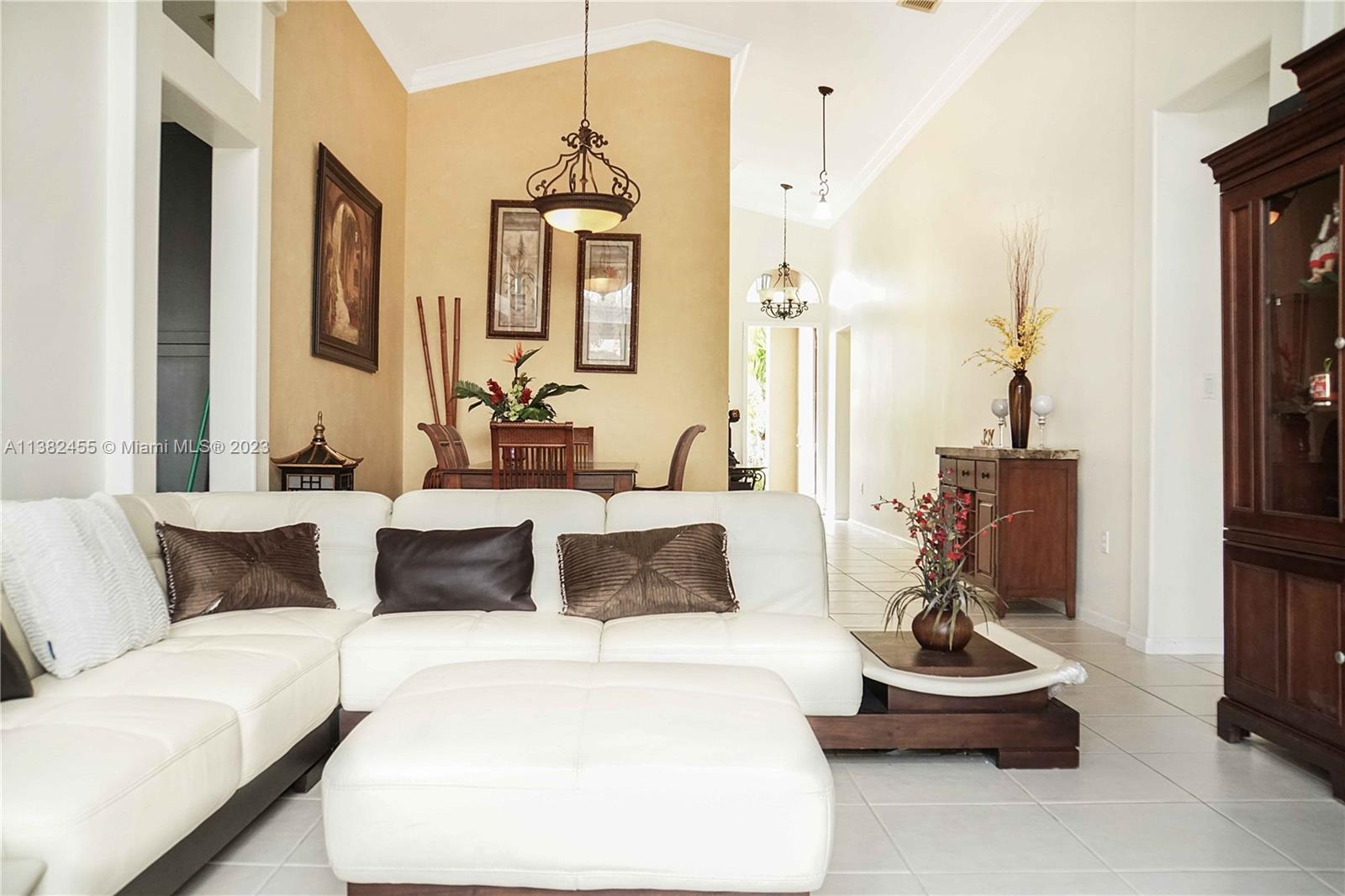 Miramar Miramar, FL 33029 - Photo 5 of 18 a living room with furniture and a chandelier