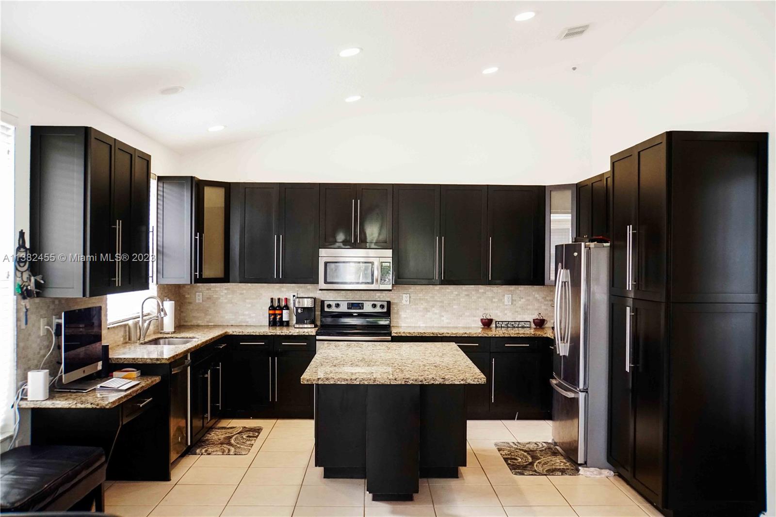 Miramar Miramar, FL 33029 - Photo 6 of 18 a kitchen with a sink stove and refrigerator