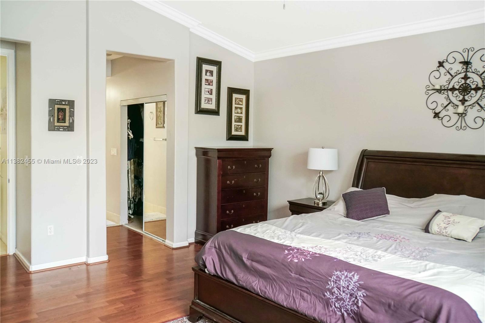 Miramar Miramar, FL 33029 - Photo 9 of 18 a bedroom with a bed and wooden floor