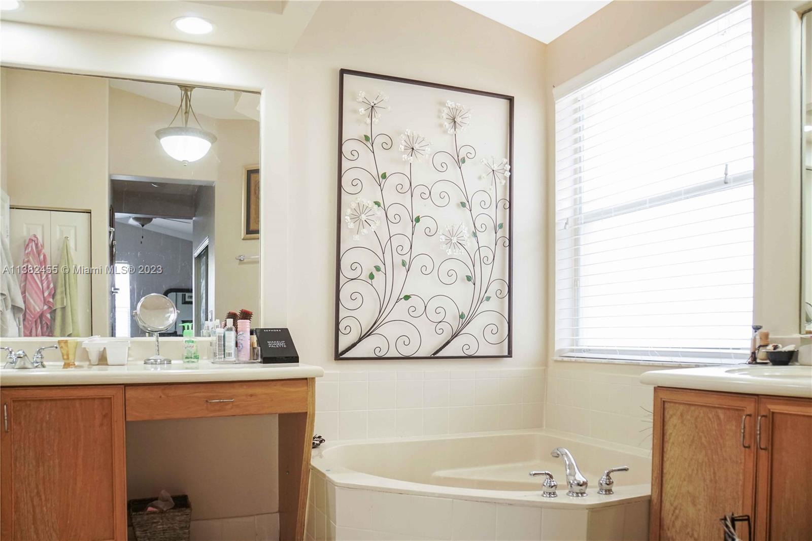Miramar Miramar, FL 33029 - Photo 10 of 18 a bathroom with a bathtub a sink and a window