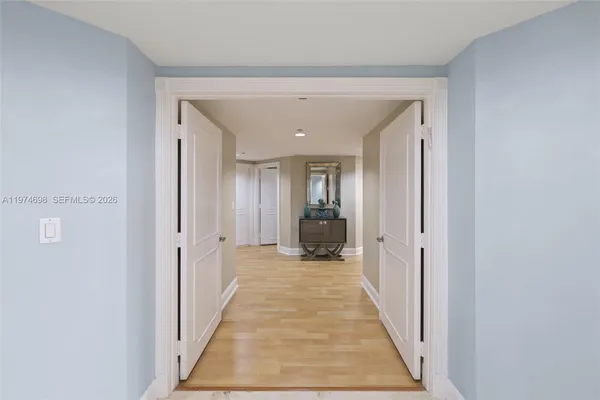 a view of a hallway with a white walls