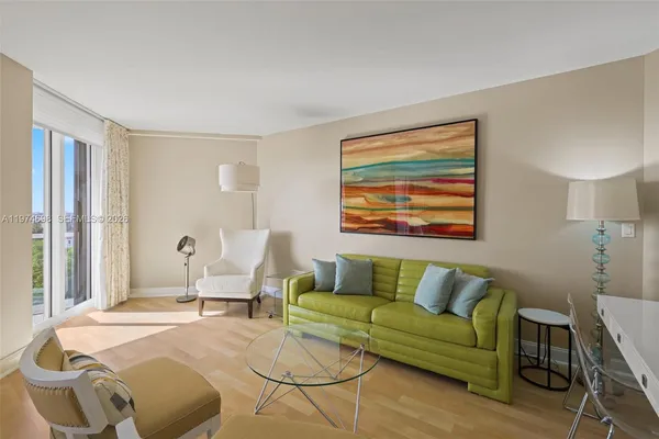 a bedroom with a bed couch and window