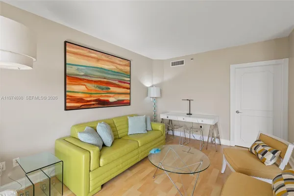 a living room with furniture and a table