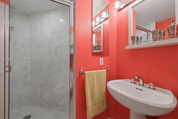 a bathroom with a sink a mirror and a toilet