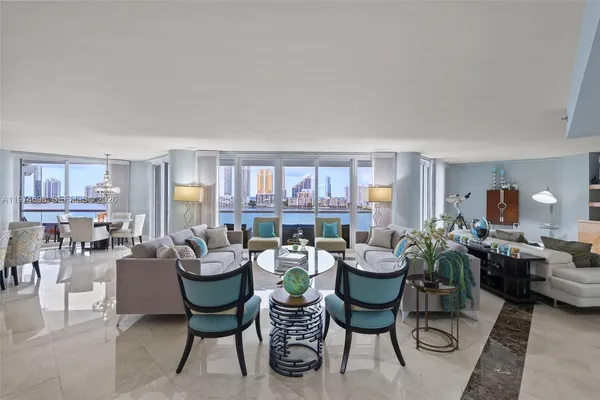 a view of a livingroom with furniture and a potted plant