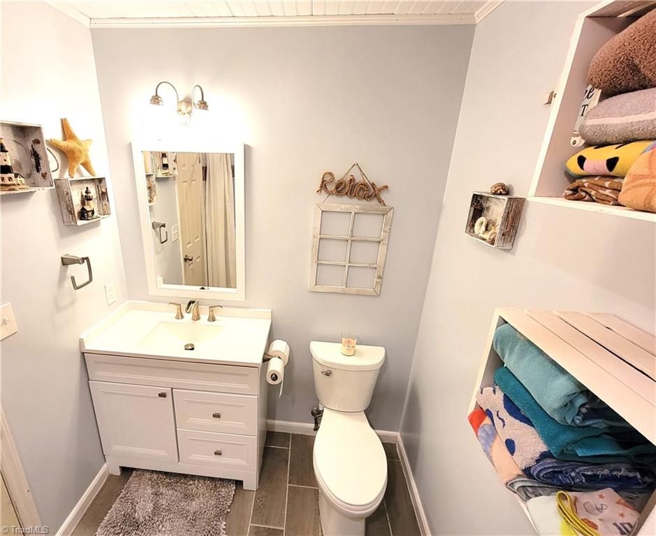 3511 Edgefield Road Greensboro, NC 27409 - Photo 12 of 16 Guest bathroom in hallway remodeled 2020 with all new tub, shower, vanity and flooring